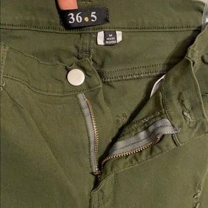 Olive green distressed ripped jeans sizeM